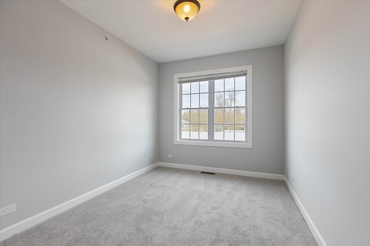 1669 Church Street Evanston, IL 60201 - Photo 22 of 31 an empty room with a window