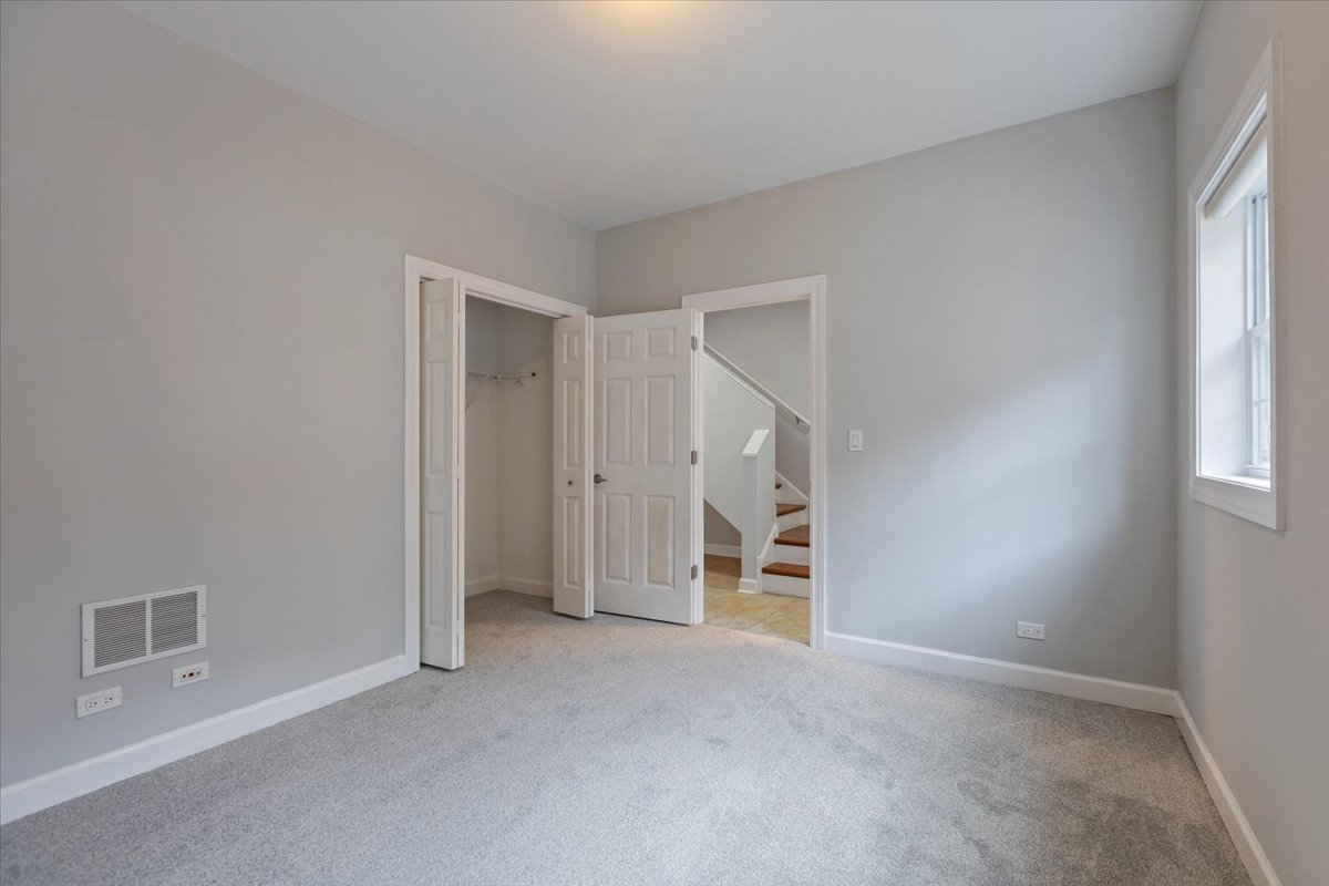 1669 Church Street Evanston, IL 60201 - Photo 27 of 31 an empty room with a natural light