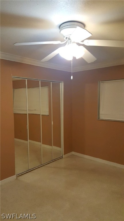1003 East Penn Road Lehigh Acres, FL 33936 - Photo 3 of 12 an empty room with a mirror and a fan