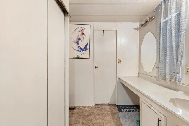 a bedroom with a bed and a closet