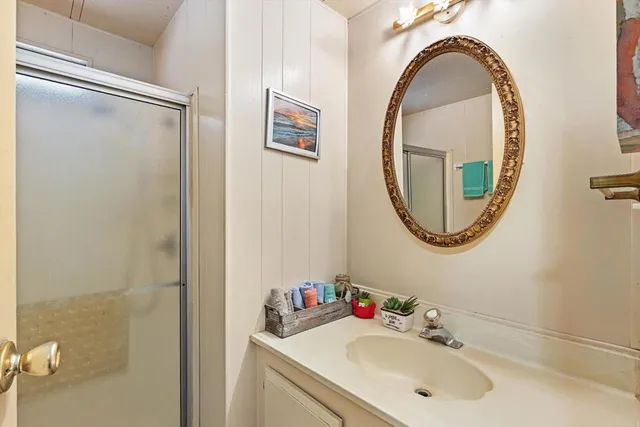 a view of washer and dryer with kitchen in the background