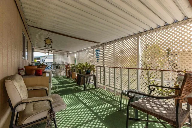 a view of a chairs and table in patio