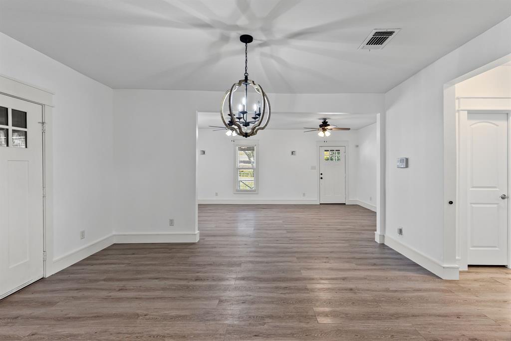 509 Maple Street Commerce, TX 75428 - Photo 11 of 36 a view of a room with wooden floor sink and window