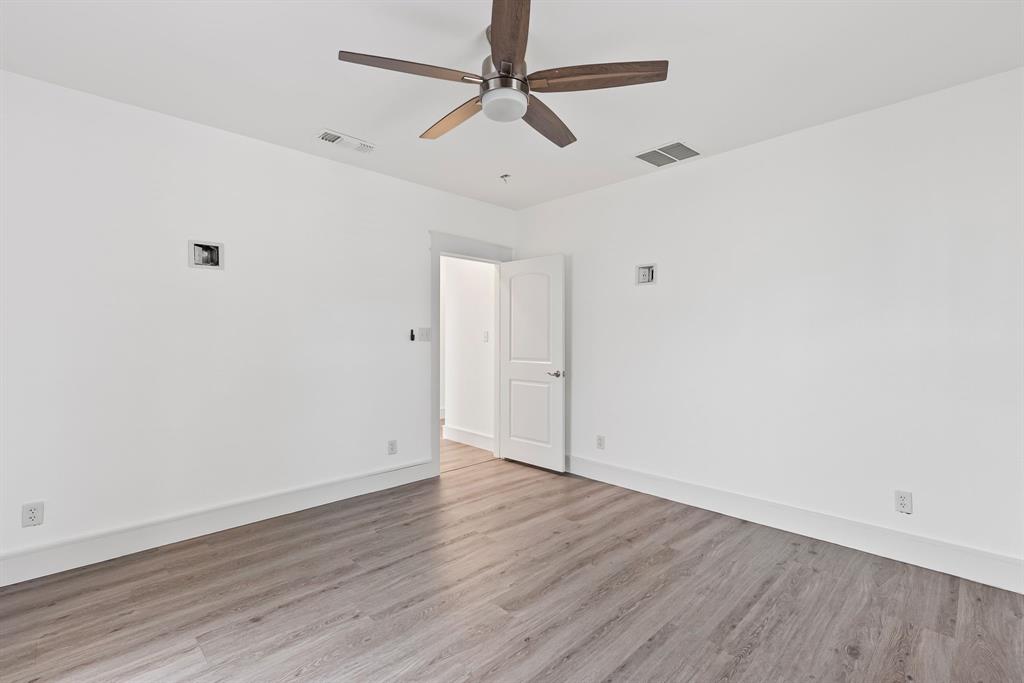 509 Maple Street Commerce, TX 75428 - Photo 19 of 36 wooden floor in an empty room