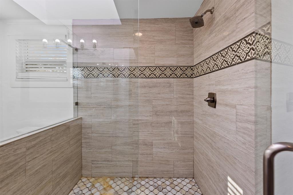 509 Maple Street Commerce, TX 75428 - Photo 22 of 36 a bathroom with a shower