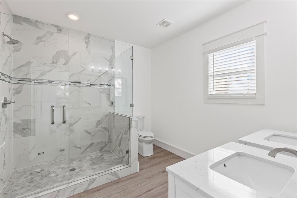 509 Maple Street Commerce, TX 75428 - Photo 24 of 36 a bathroom with a sink toilet and shower
