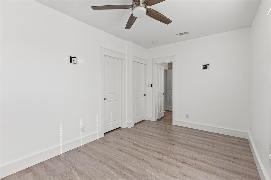 509 Maple Street Commerce, TX 75428 - Photo 26 of 36 a view of an empty room with wooden floor