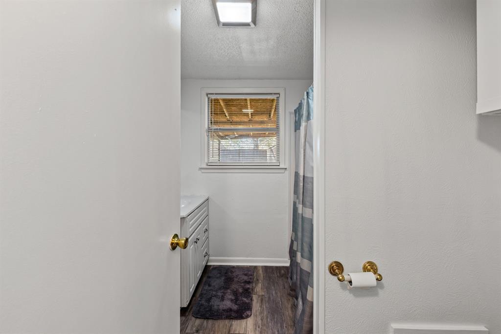 509 Maple Street Commerce, TX 75428 - Photo 33 of 36 a view of an entryway with wooden floor