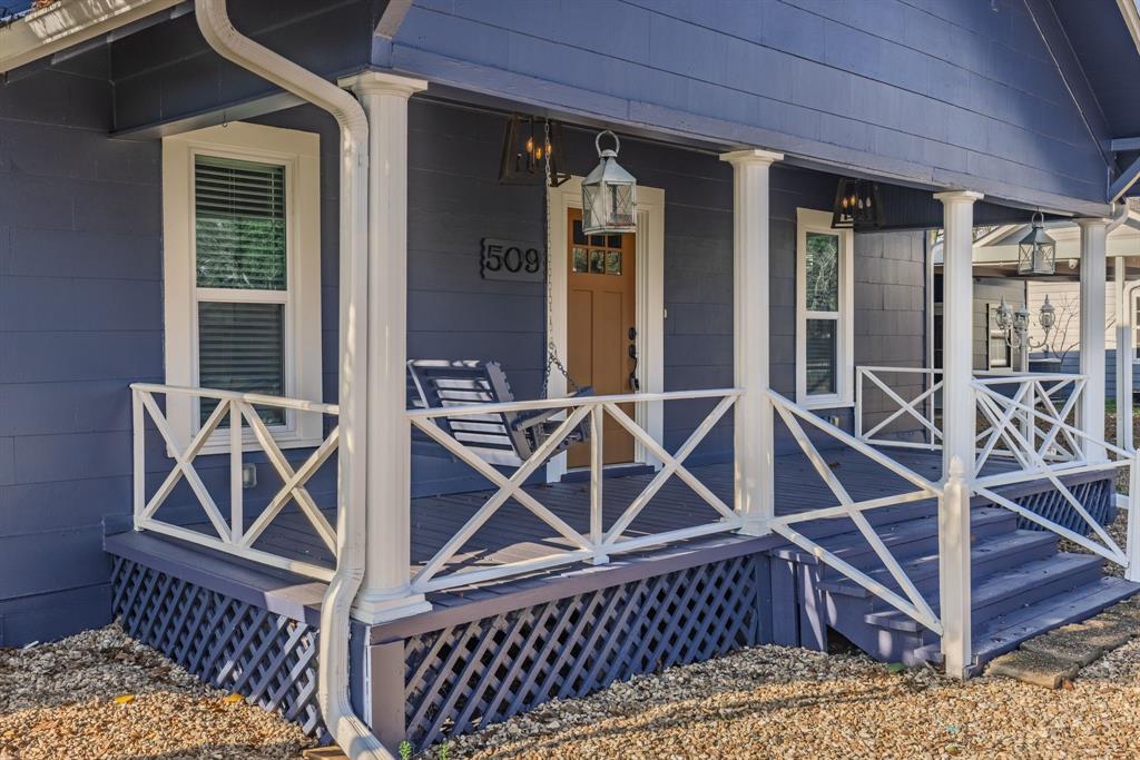 509 Maple Street Commerce, TX 75428 - Photo 4 of 36 a view of a balcony with chairs and a potted plant