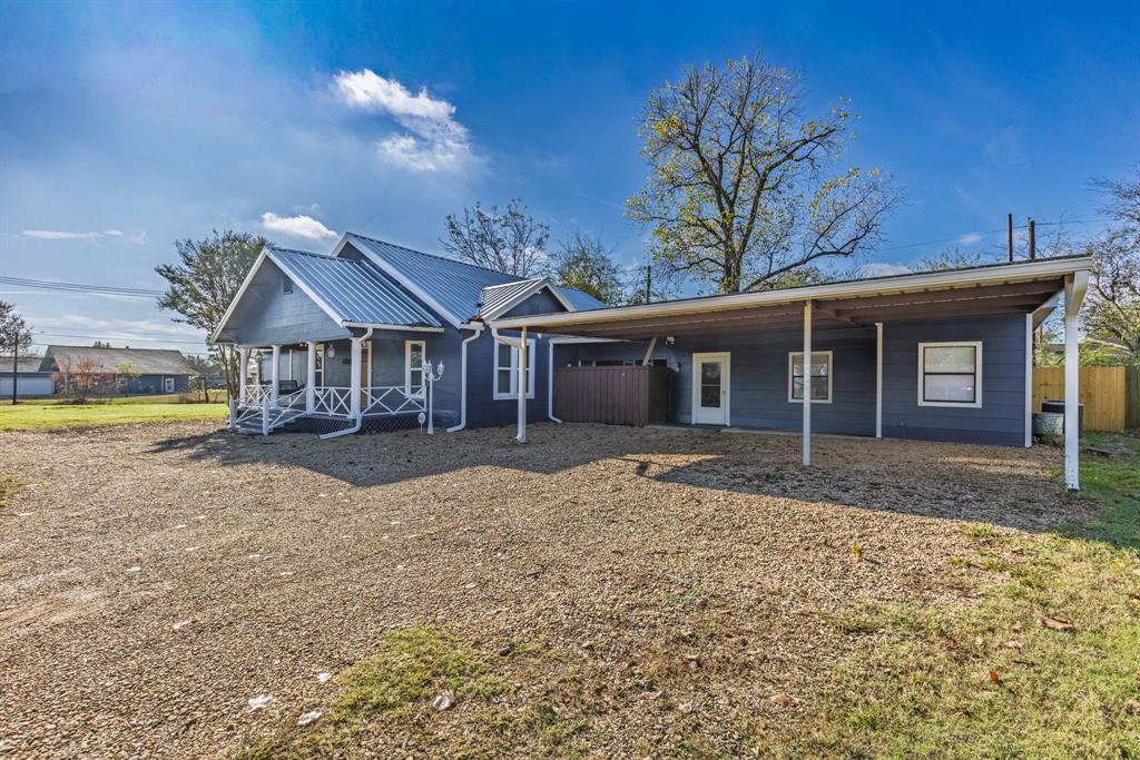 509 Maple Street Commerce, TX 75428 - Photo 5 of 36 a view of a house with a patio