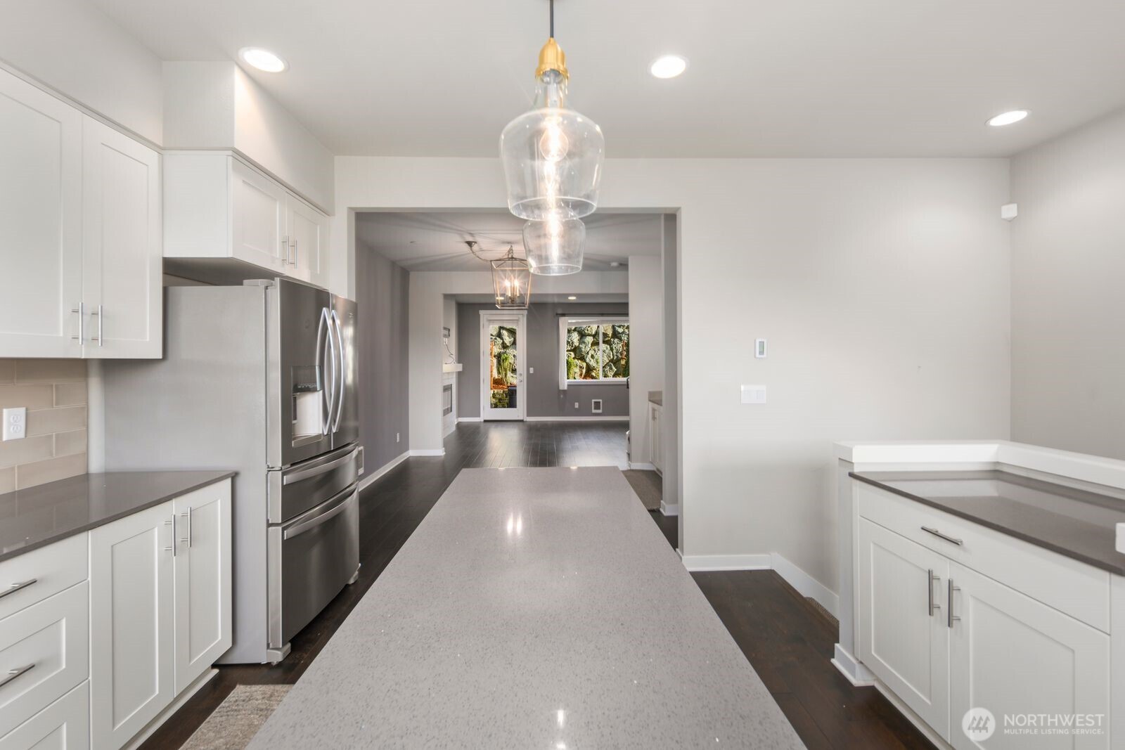 1325 Seattle Hill Road, Unit A2 Bothell, WA 98012 - Photo 12 of 34 a view of a kitchen center island cabinets and stainless steel appliances