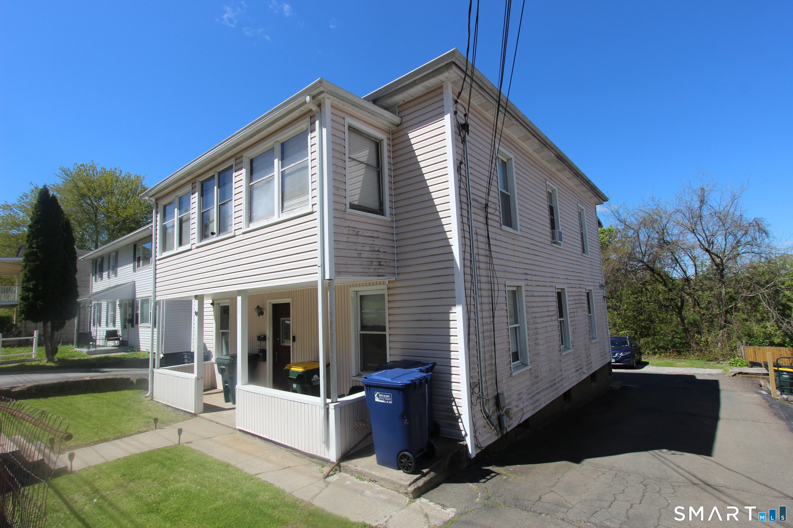23 North Spring Street Ansonia, CT 06401 - Photo 2 of 7 a front view of a house with a yard