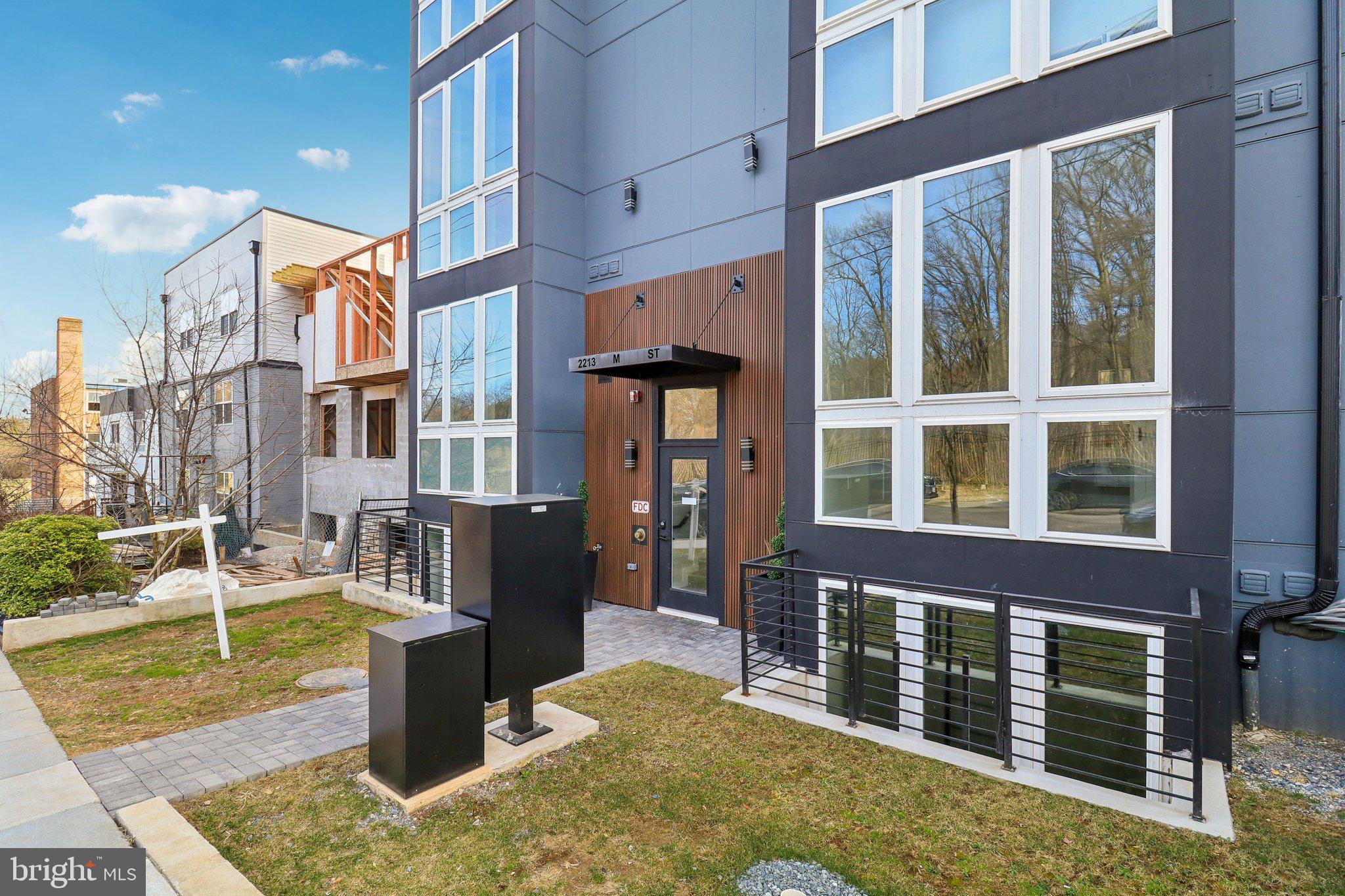 2213 M Street Northeast, Unit 4 Washington, DC 20002 - Photo 1 of 39 a front view of a building with a porch