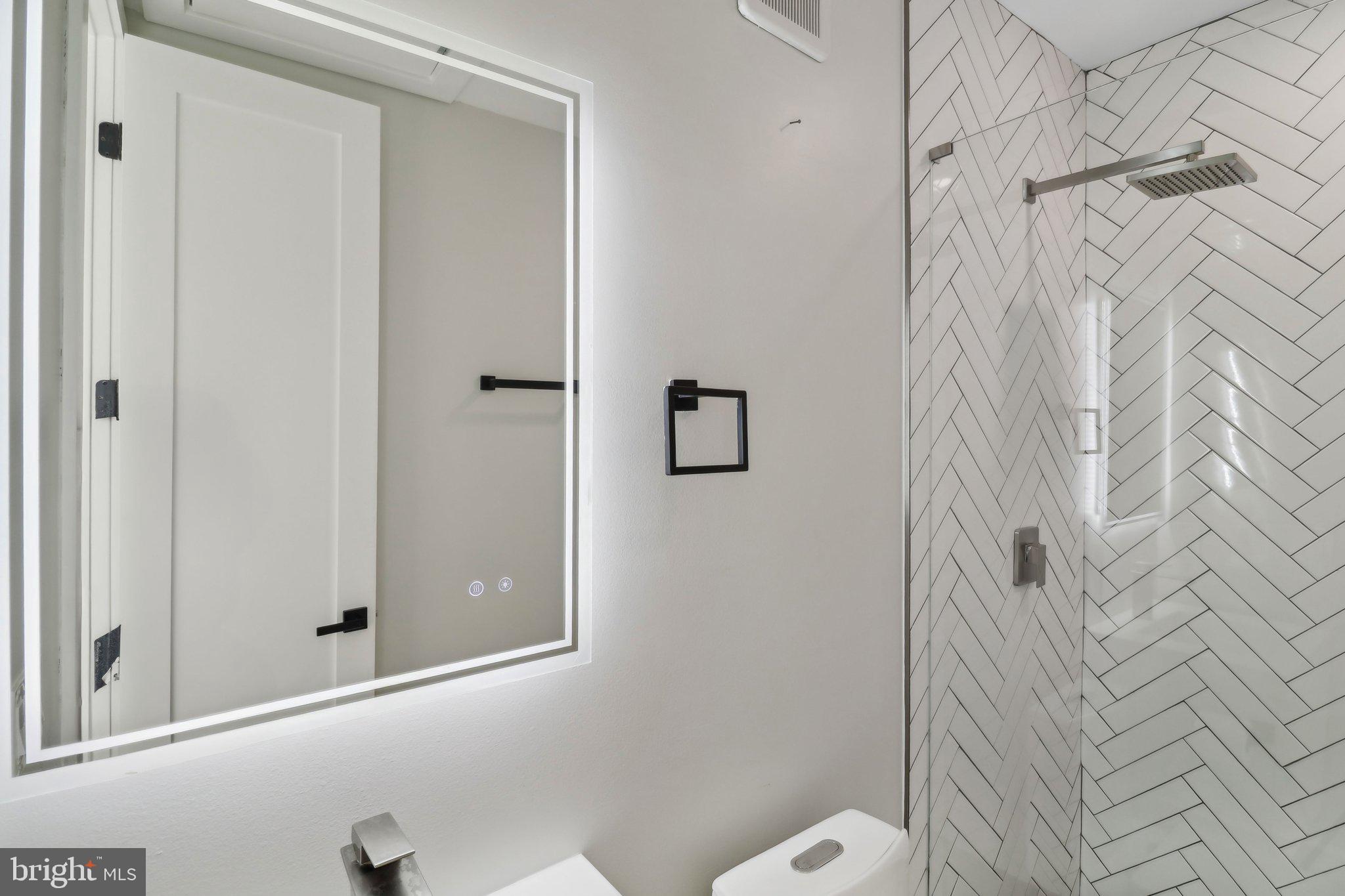 2213 M Street Northeast, Unit 4 Washington, DC 20002 - Photo 14 of 39 a bathroom with a shower and a toilet