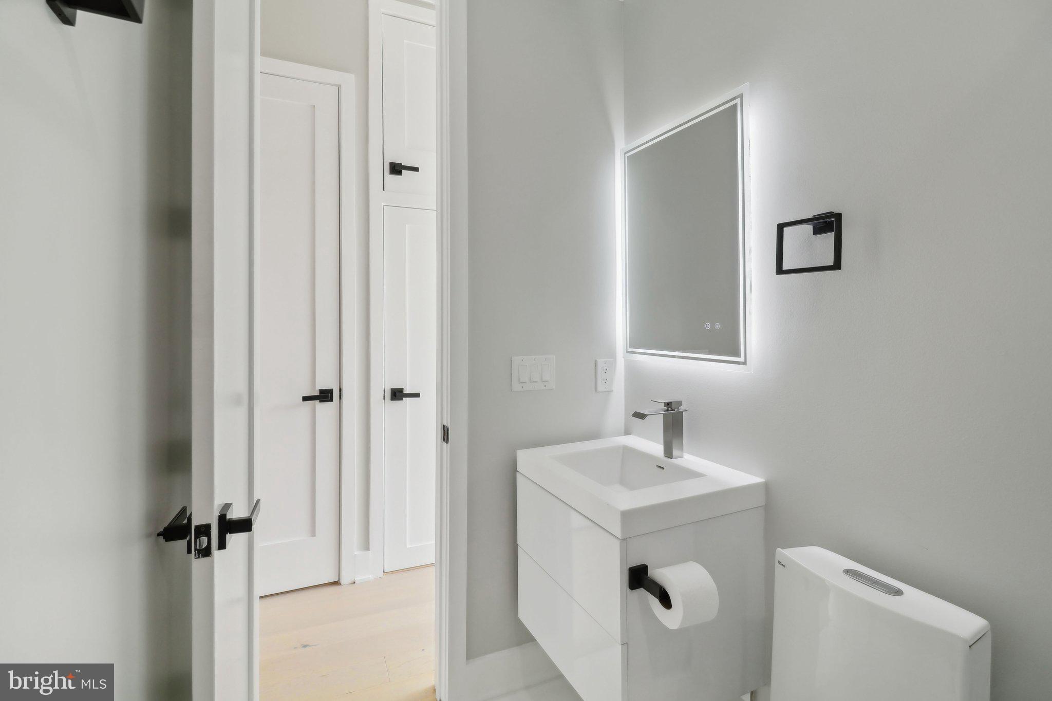 2213 M Street Northeast, Unit 4 Washington, DC 20002 - Photo 20 of 39 a bathroom with a sink and a mirror