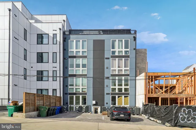 a front view of a building with a street