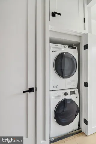 a view of a hallway with washer and dryer
