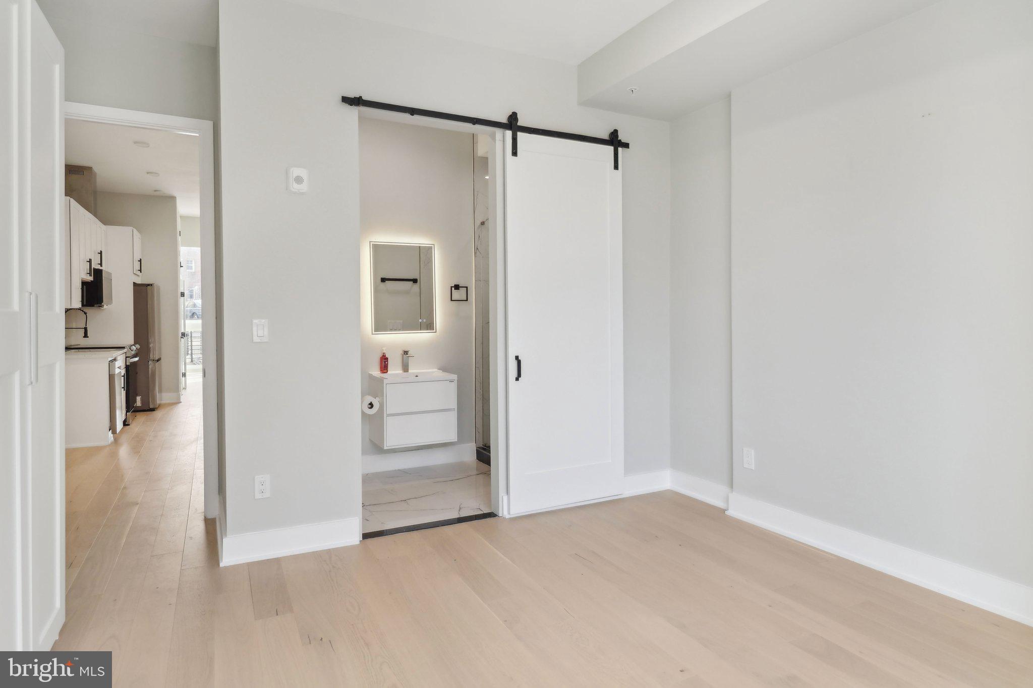 2213 M Street Northeast, Unit 4 Washington, DC 20002 - Photo 32 of 39 a view of a walk in closet with wooden floor