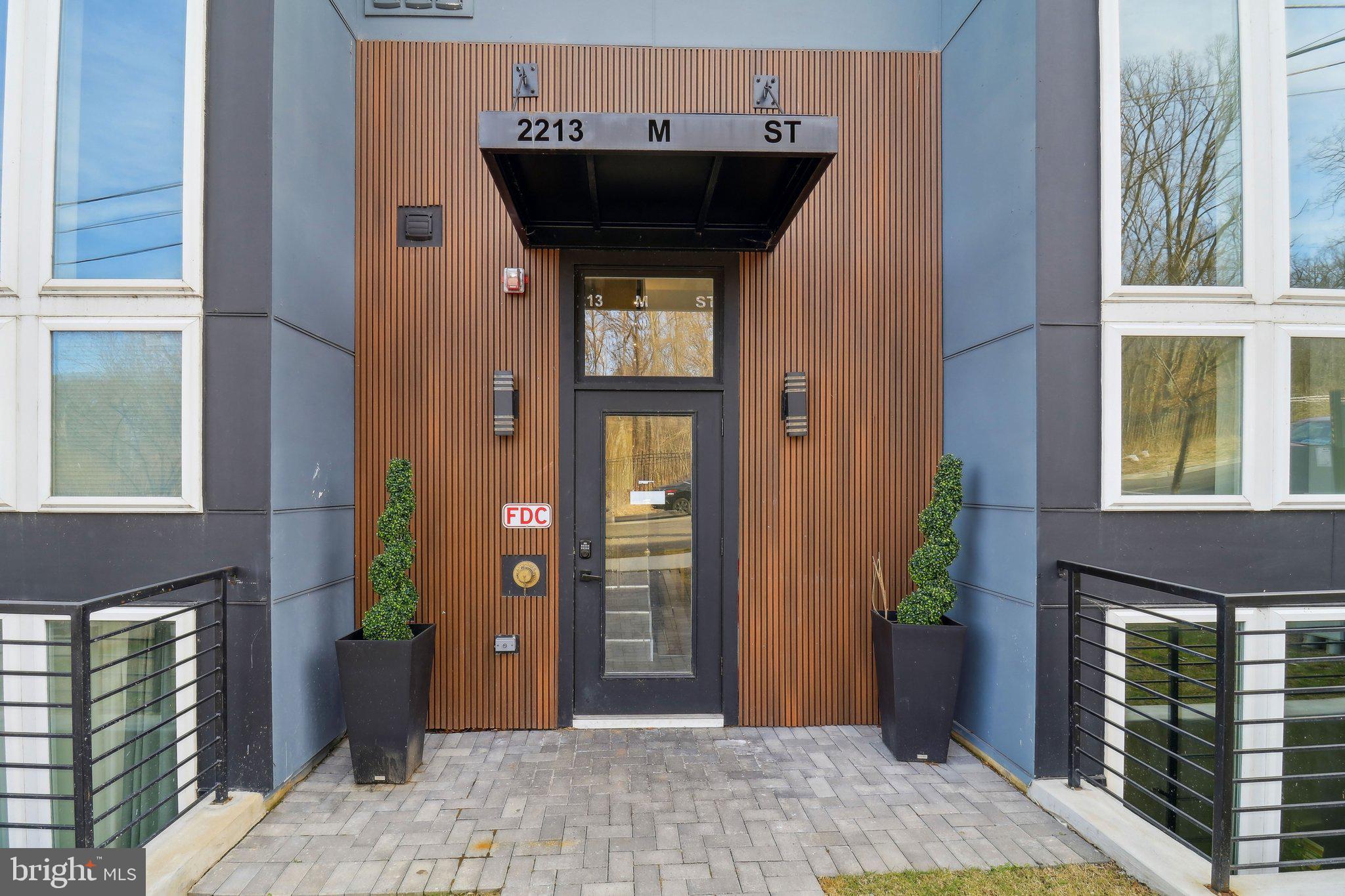 2213 M Street Northeast, Unit 4 Washington, DC 20002 - Photo 5 of 39 a view of entryway of a house with potted plants
