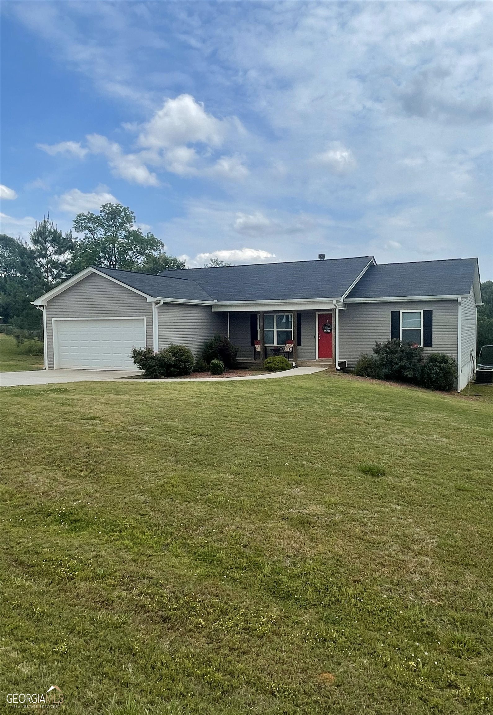 86 Isabelle's Way Colbert, GA 30628 - Photo 1 of 1 a house view with a garden space