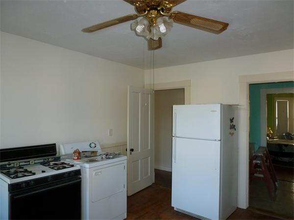 21 Congress Street Amesbury, MA 01913 - Photo 17 of 24 a kitchen with a refrigerator and a stove