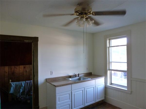 21 Congress Street Amesbury, MA 01913 - Photo 18 of 24 a bathroom with a granite countertop sink a vanity and a window