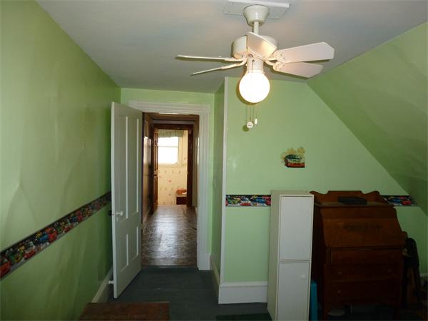 21 Congress Street Amesbury, MA 01913 - Photo 20 of 24 a view of a hallway with wooden floor