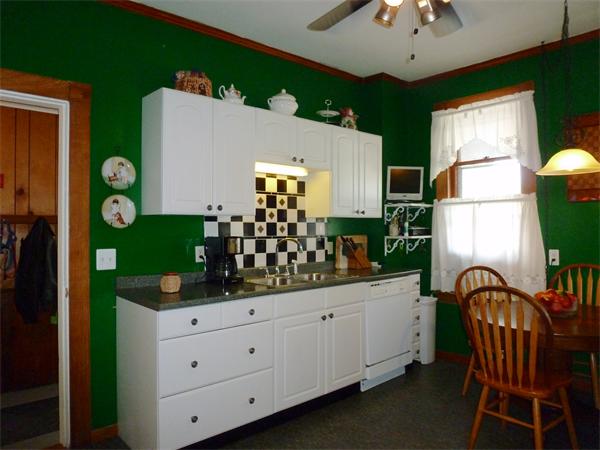 21 Congress Street Amesbury, MA 01913 - Photo 4 of 24 a kitchen with cabinets and window