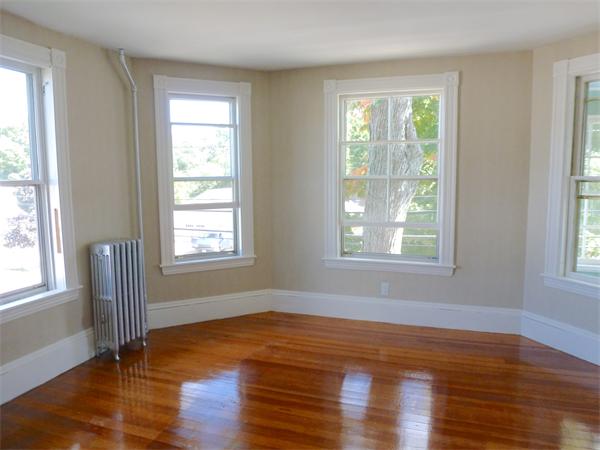 21 Congress Street Amesbury, MA 01913 - Photo 10 of 24 a view of empty room with wooden floor and fan