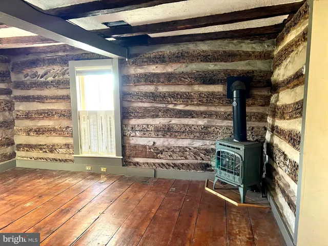 a view of entrance with wooden floor and windows