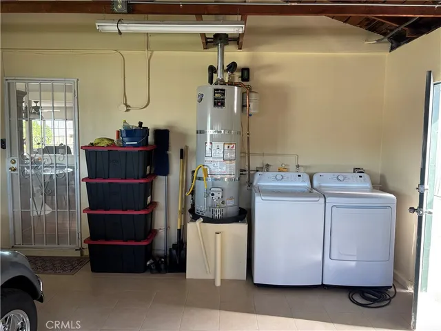a view of a house with a yard and ocean view