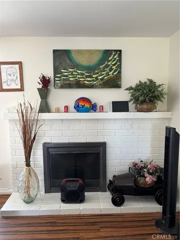 a living room with a bookshelf and a fireplace