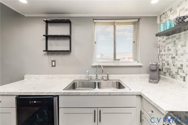 a kitchen with a sink and a window