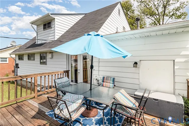 a patio with a table and chairs