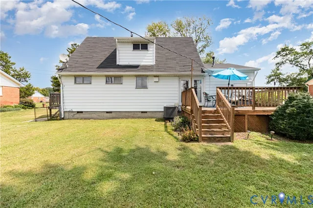 a view of a house with pool and chairs