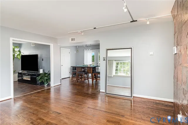 a view of a livingroom with furniture and a flat screen tv