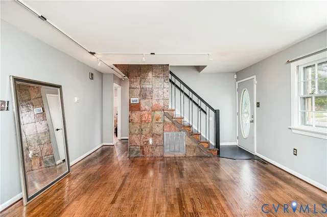 a view of entryway with wooden floor
