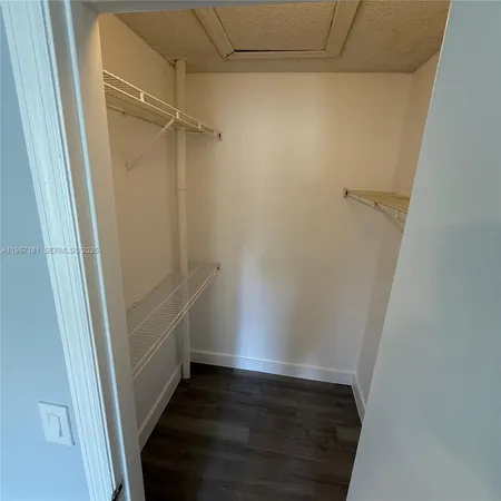 a view of an empty walk in closet