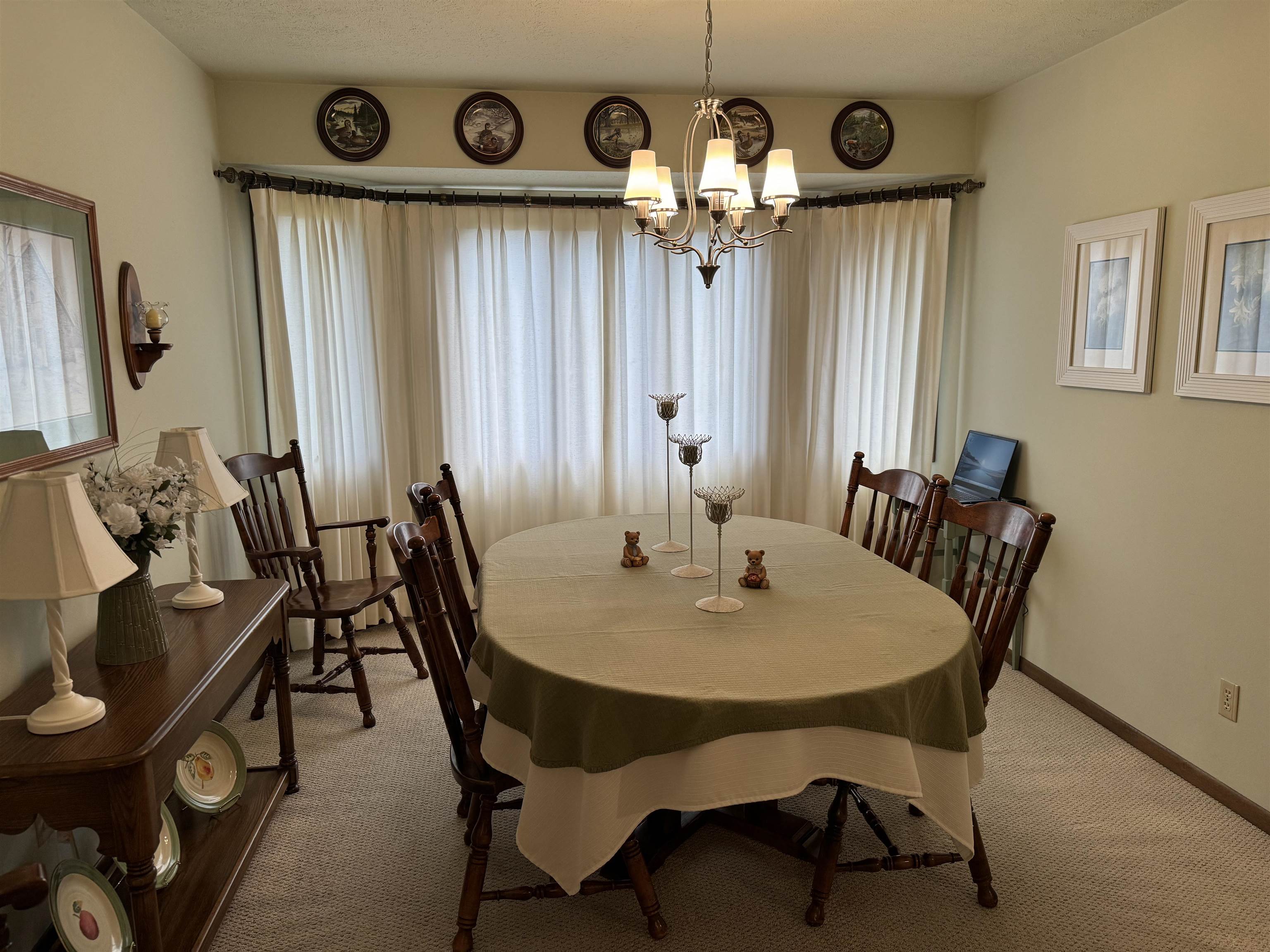 12255 Rae Ann Road Roscoe, IL 61073 - Photo 17 of 37 a view of a dining room with furniture and a large window