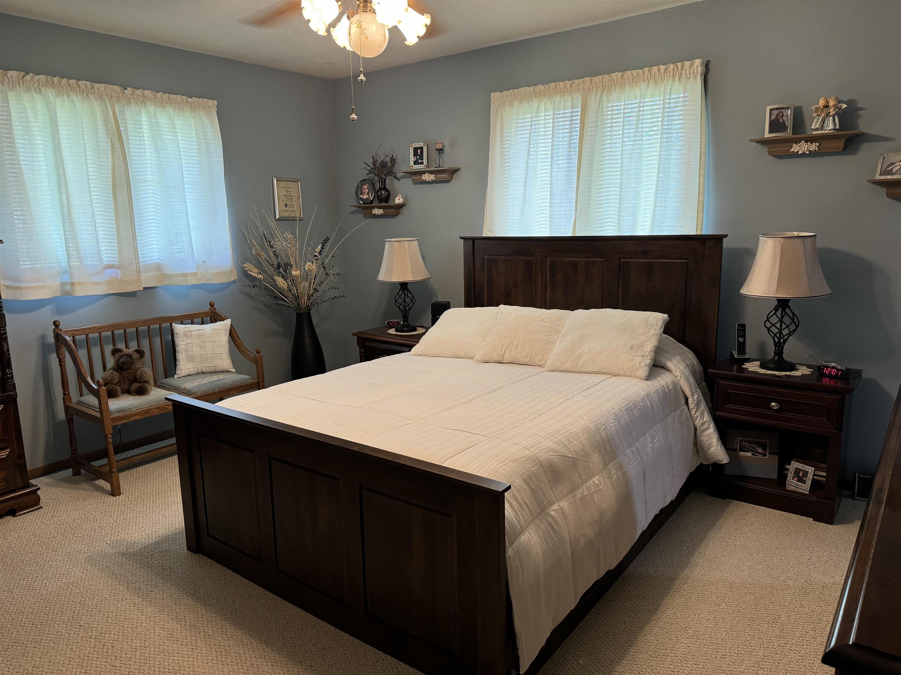 12255 Rae Ann Road Roscoe, IL 61073 - Photo 20 of 37 a bedroom with a bed and a lamp