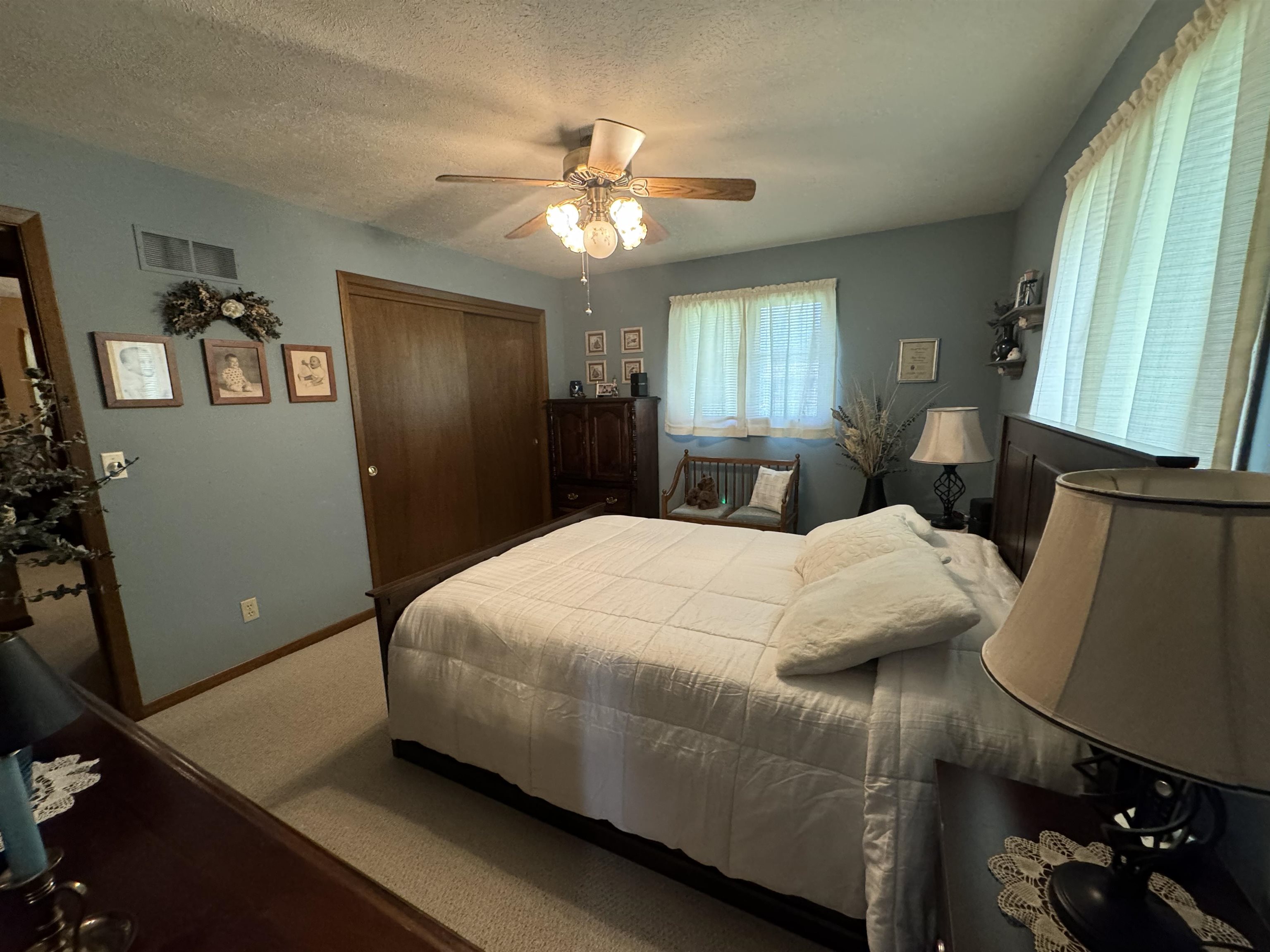 12255 Rae Ann Road Roscoe, IL 61073 - Photo 21 of 37 a bedroom with a bed and a mirror