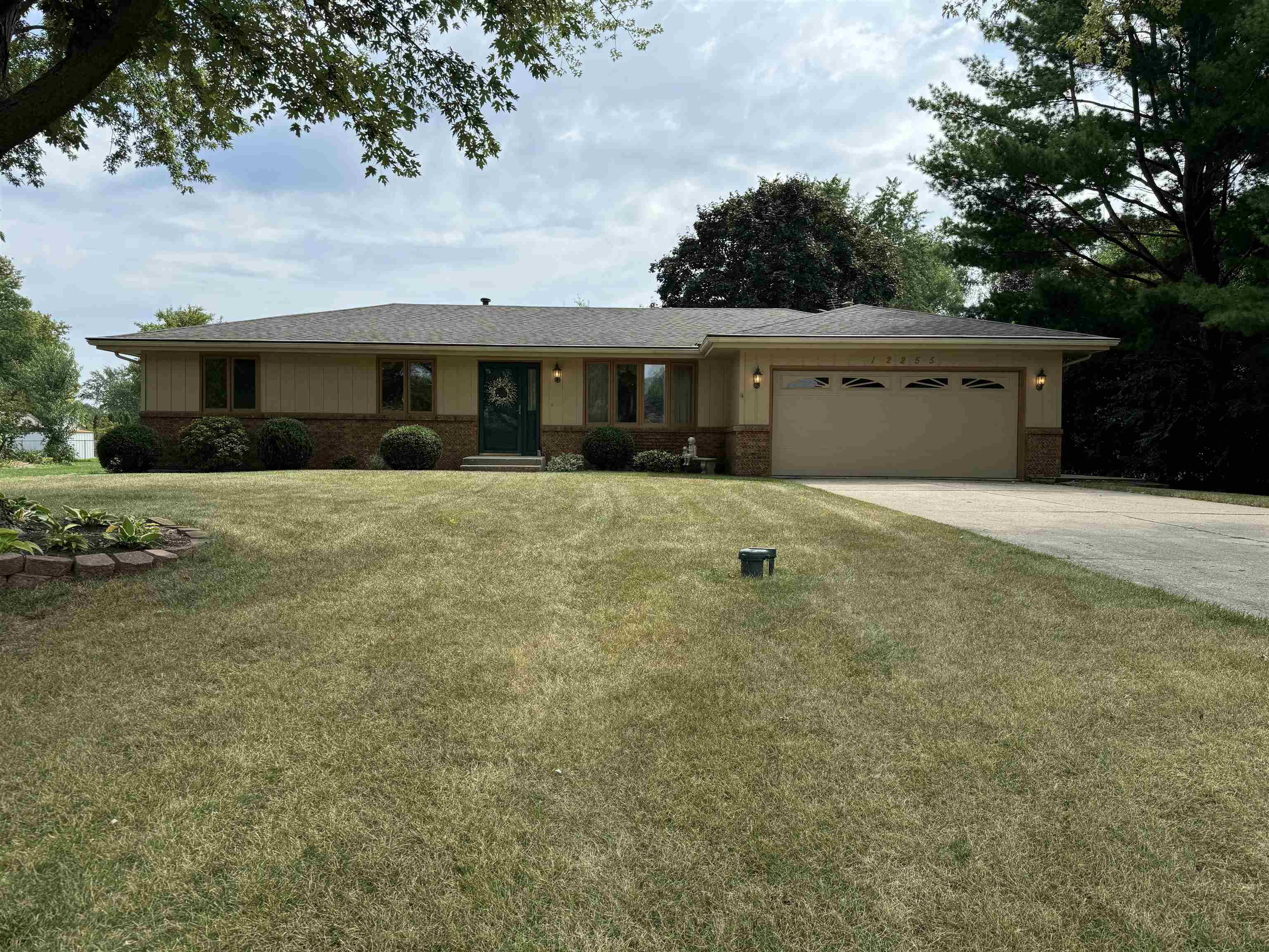12255 Rae Ann Road Roscoe, IL 61073 - Photo 3 of 37 a front view of a house with a yard