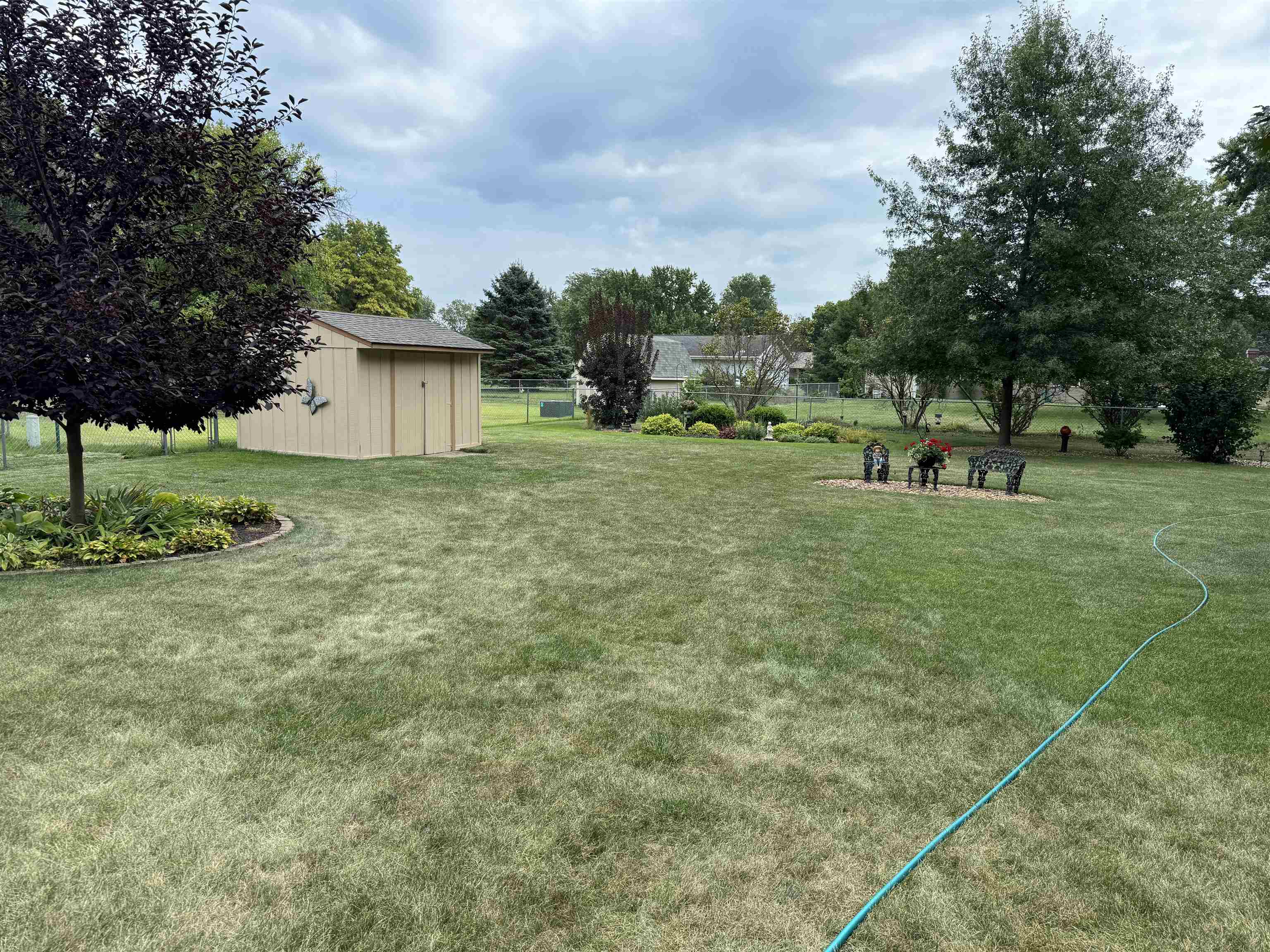 12255 Rae Ann Road Roscoe, IL 61073 - Photo 34 of 37 a view of a house with a backyard