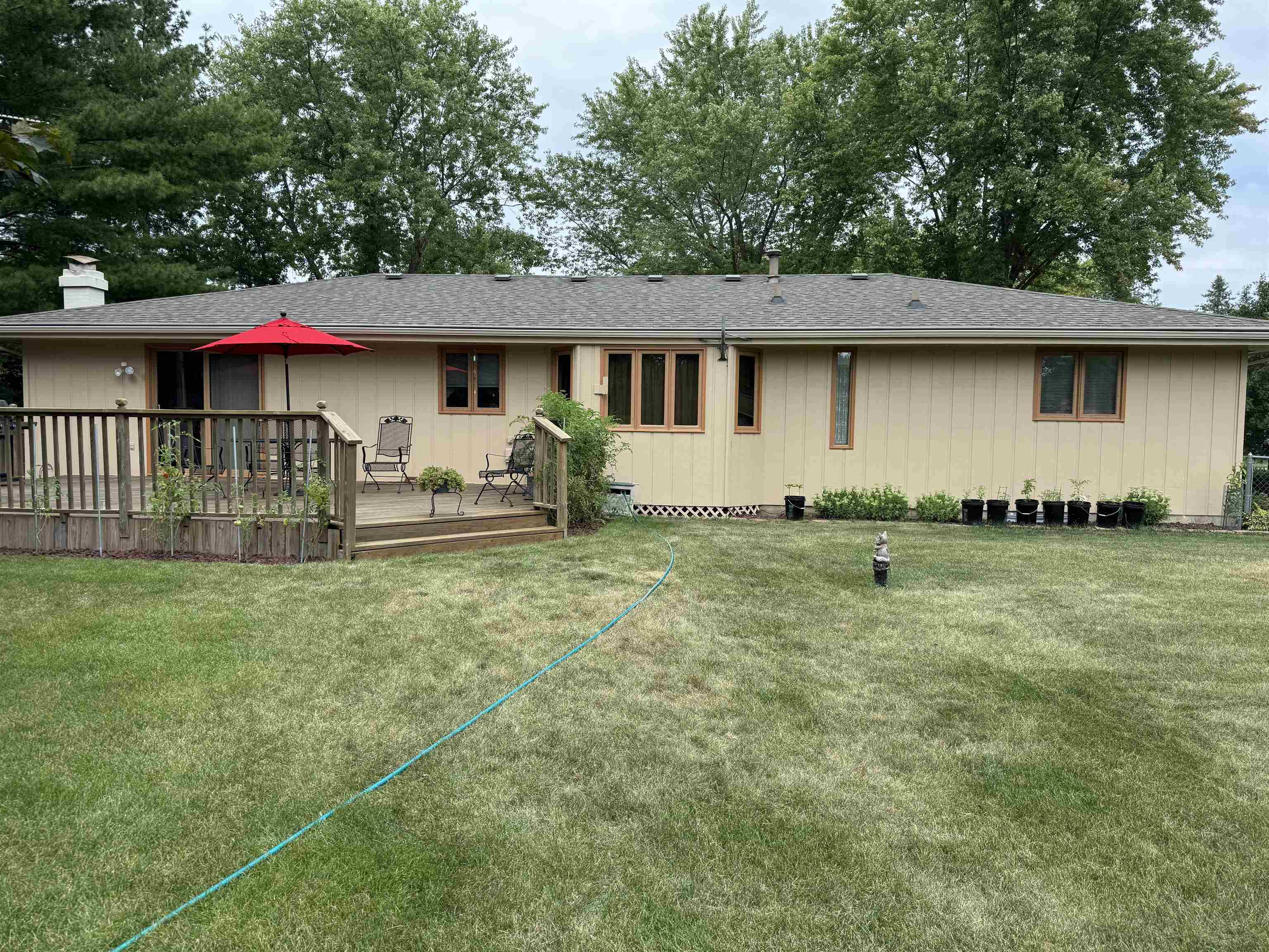 12255 Rae Ann Road Roscoe, IL 61073 - Photo 37 of 37 a front view of a house with garden