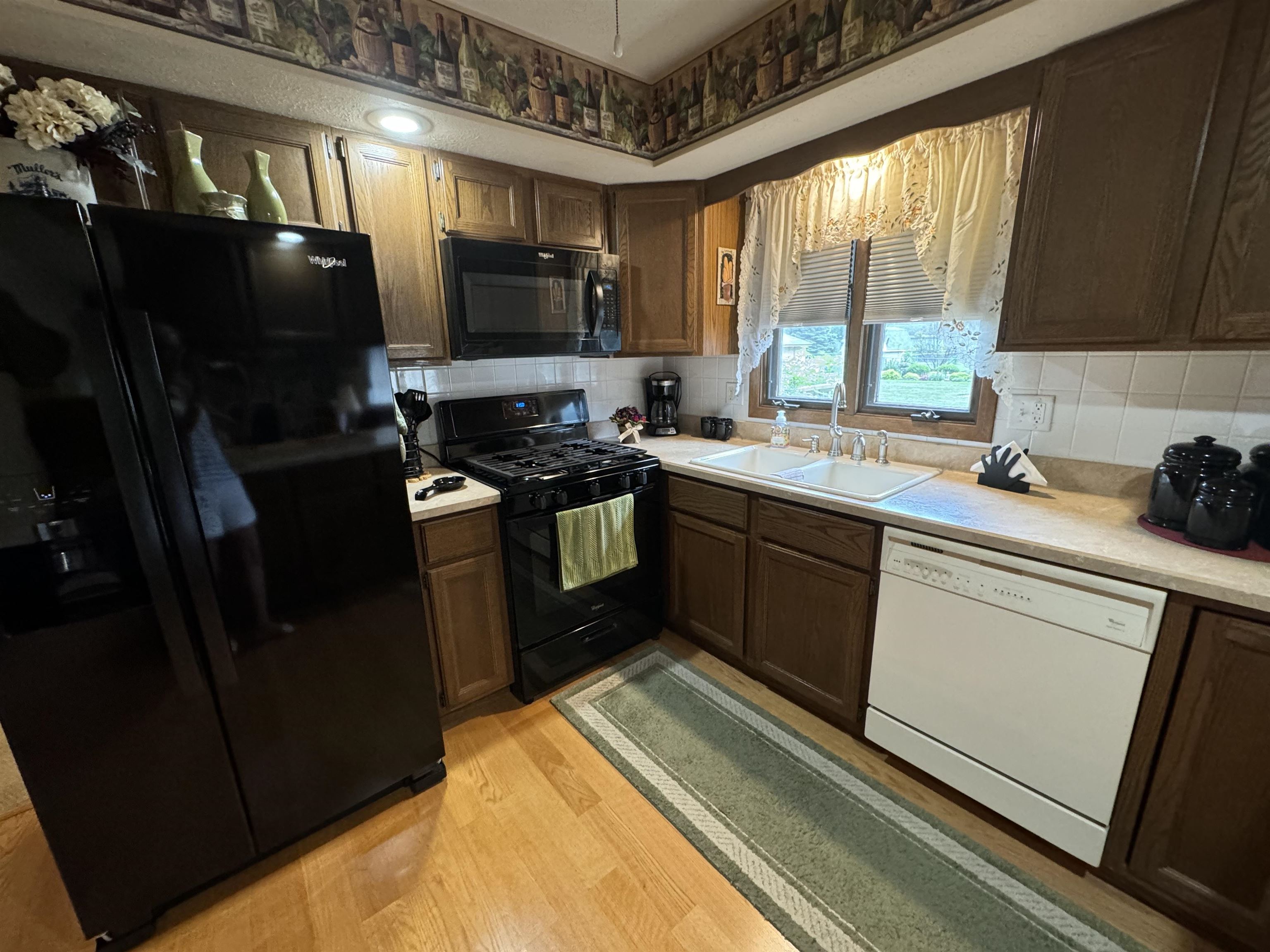 12255 Rae Ann Road Roscoe, IL 61073 - Photo 9 of 37 a kitchen with a sink appliances and cabinets