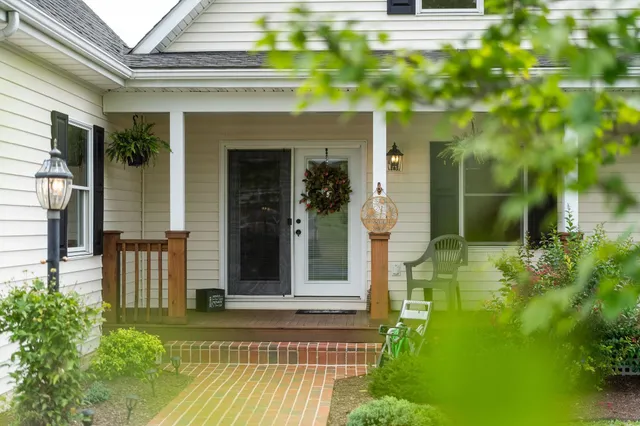 a kitchen with stainless steel appliances a stove a sink a microwave a refrigerator and cabinets