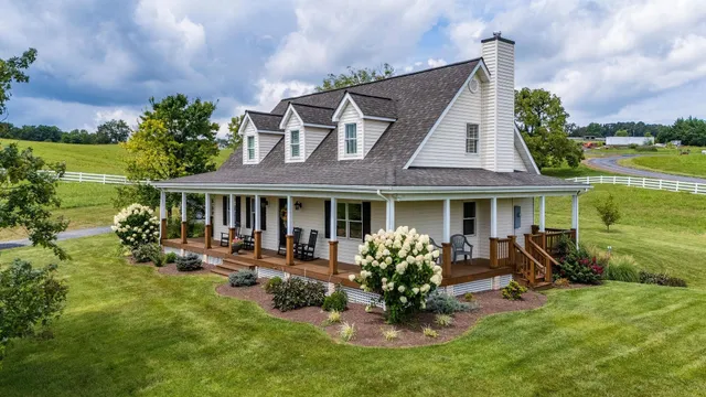 an aerial view of a house with big yard
