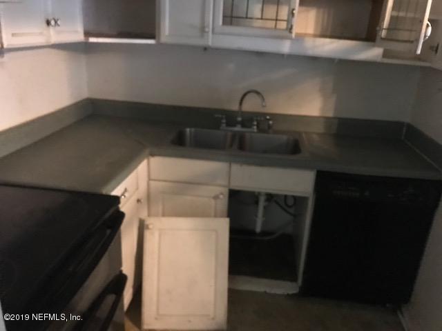 5205 Hancock Road Jacksonville, FL 32254 - Photo 11 of 25 a kitchen with a sink and cabinets