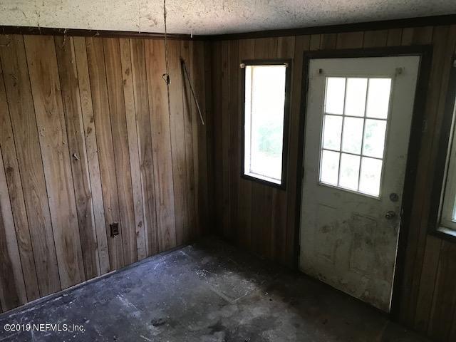 5205 Hancock Road Jacksonville, FL 32254 - Photo 15 of 25 an empty room with windows