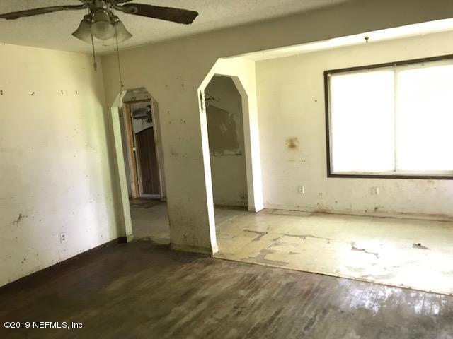 5205 Hancock Road Jacksonville, FL 32254 - Photo 17 of 25 a view of a room with wooden floor and a window